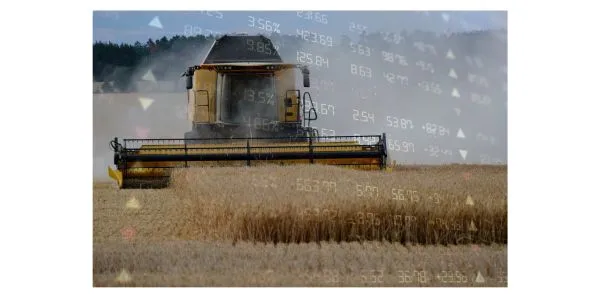 Tractor harvesting wheat with stock market chart overlay